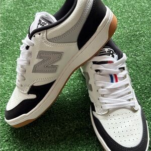New Balance White and Black Sneakers with Gum Sole